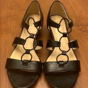 Size 10 black sandals with heel.